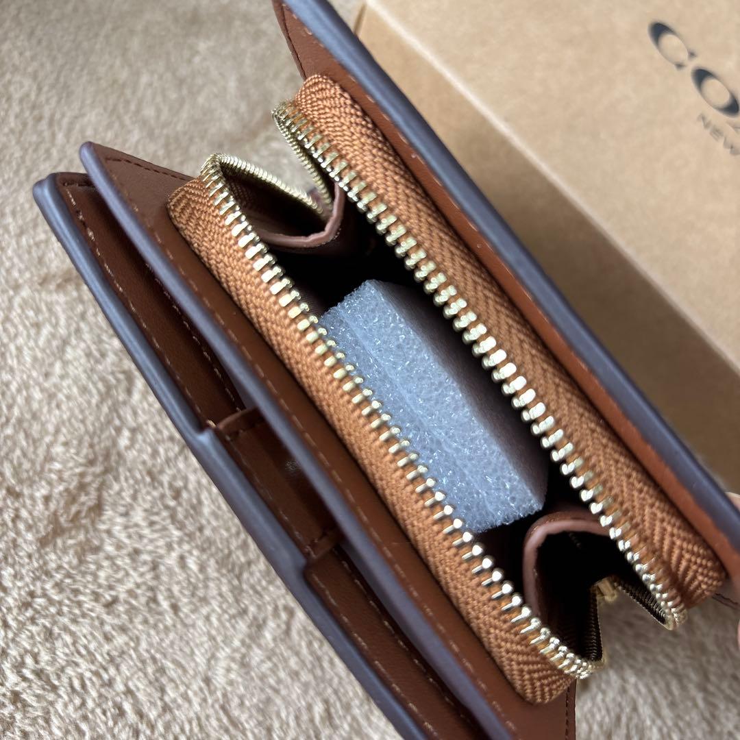 ゆかコーチ スナップウォレット シグネチャーキャンバス タン ブラウン