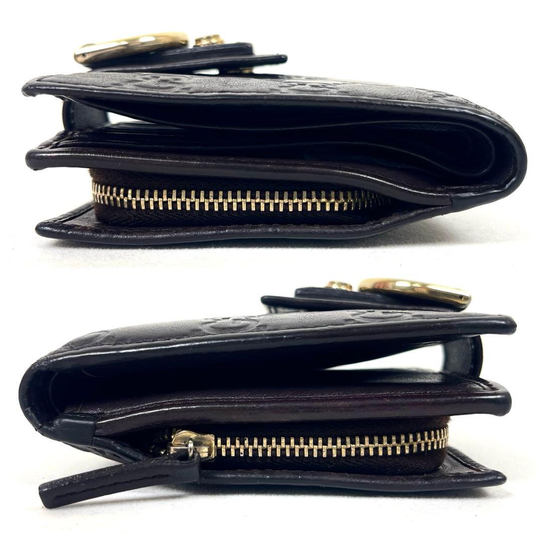 グッチ　二つ折り財布　アビー　シマレザー　ラウンドファスナー　ロゴ　エンボス