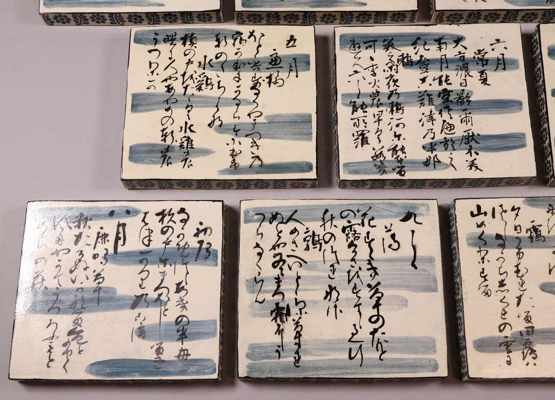 尾形乾山写 定家十二カ月花鳥和歌色絵皿 十一枚 共箱 解説書 角皿【MA498】