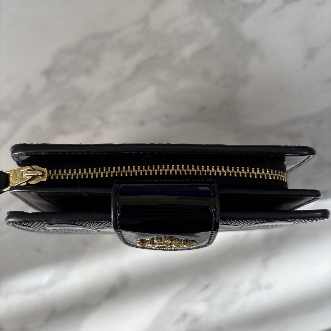 【美品】COACH コーチ 折り財布シグネチャーエンボス加工パテントレザー　黒
