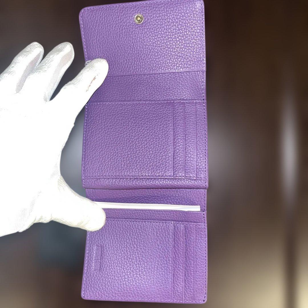 新品タグ付、 アナスイ、パープル、型押し牛革二つ折り財布