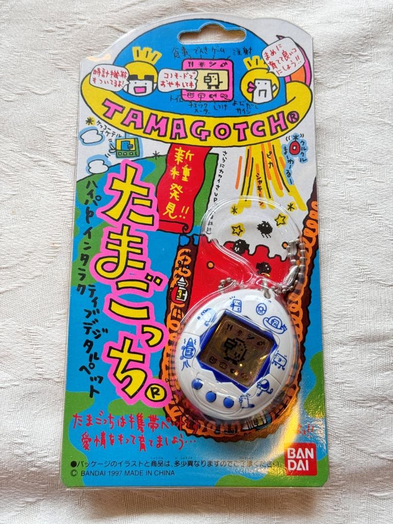 【未使用品】1997年製　第二弾発売　新種発見たまごっち＆「たまごっちと遊ぶ本」