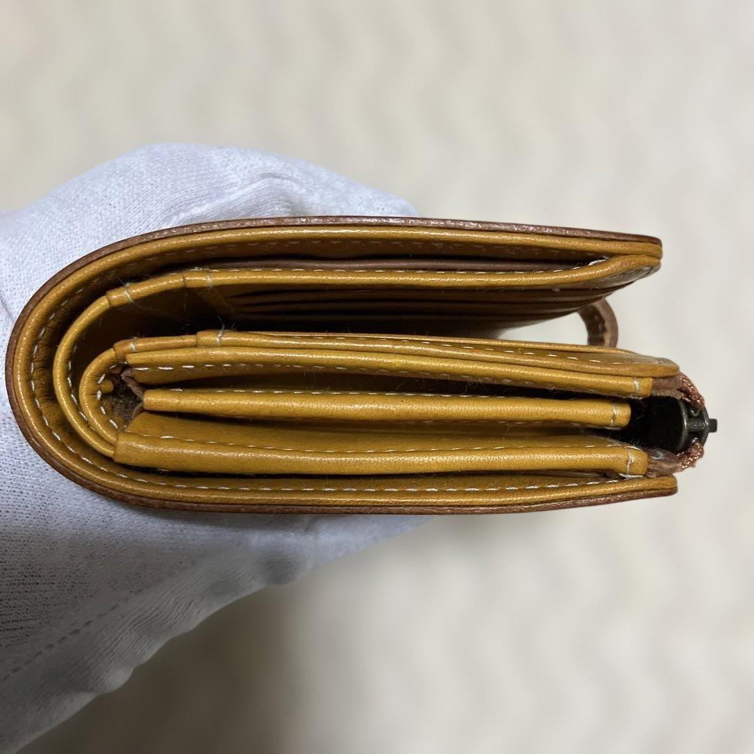 (美品) genten ゲンテン　カットワークレザー　二つ折り財布　オシャレ