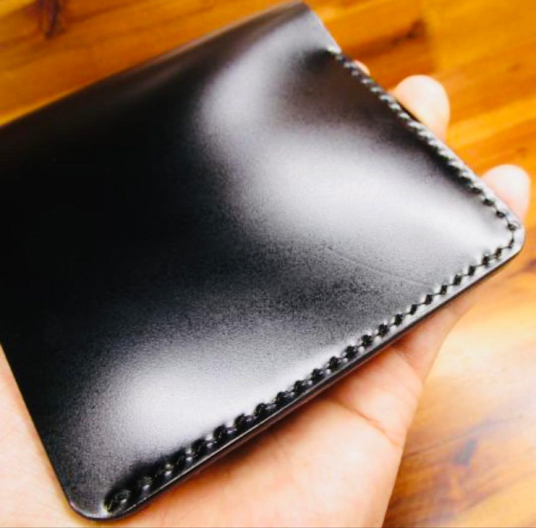 か*ん様 世界に１つ❗️新喜皮革 コードバン ブラック 黒 手縫い 二つ折り 栃