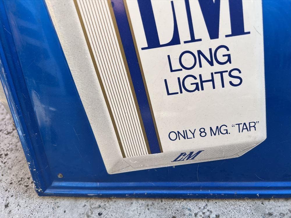 ビンテージ看板 LESSLESS TRA THAN LEADING LONGS！