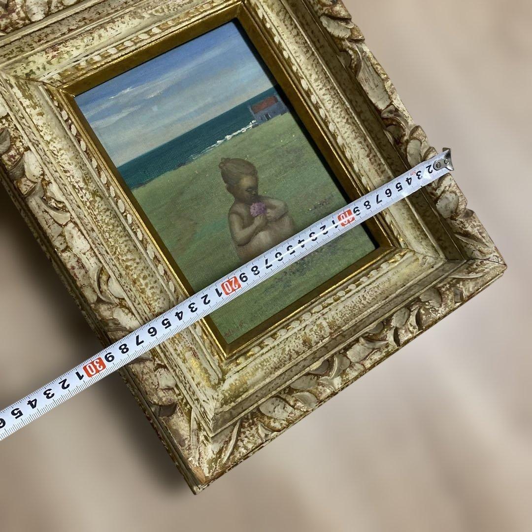 海辺の少女の油彩画