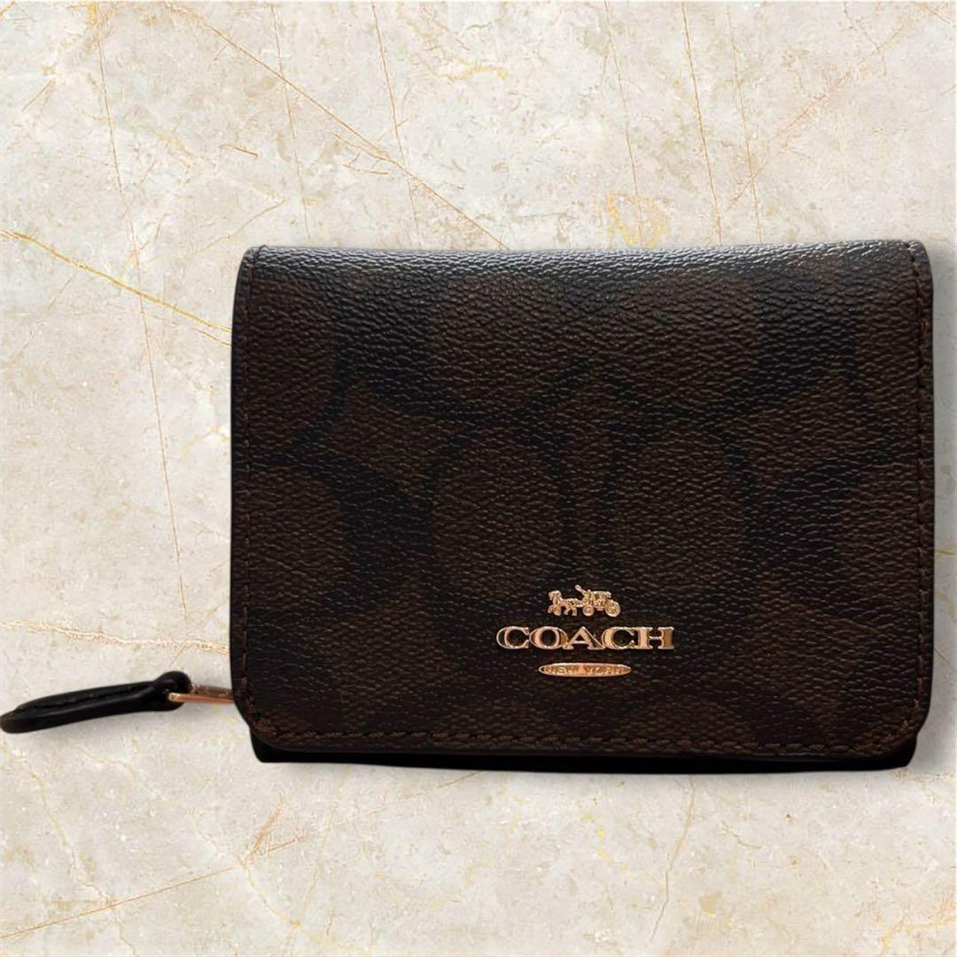 ヌルホリラ様 新品級✨ COACH コーチ シグネチャー柄 三つ折り財布