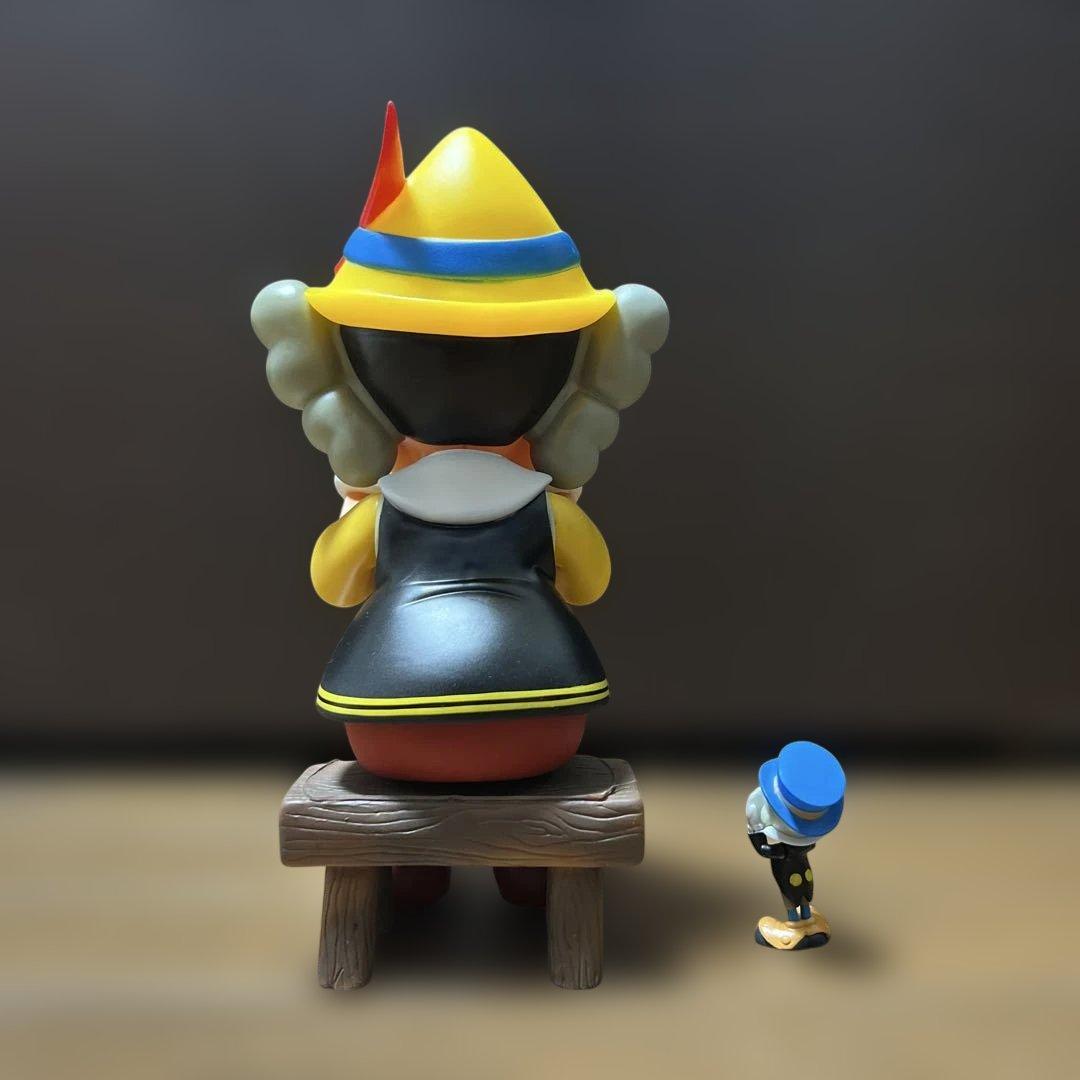 値下げ中カウズ KAWS Pinocchio & Jiminy Cricket
