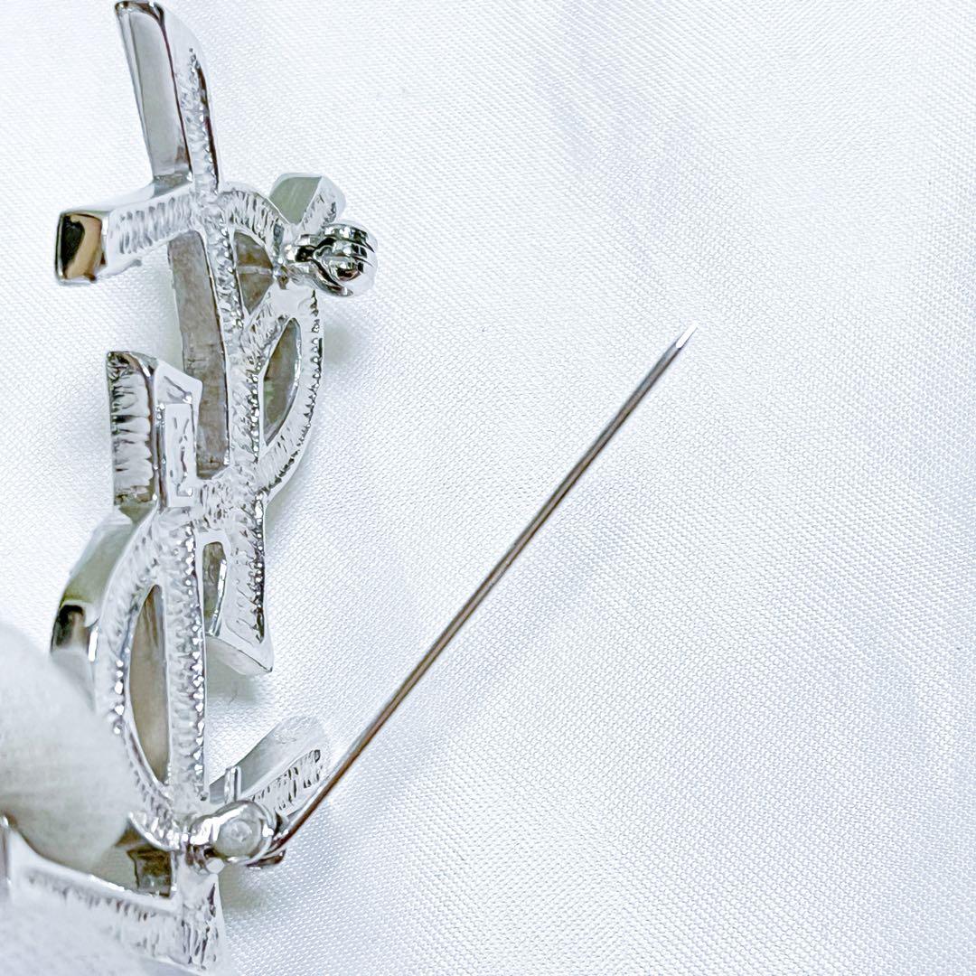 イヴサンローラン ブローチ カサンドラ YSLロゴ　ラインストーン シルバー