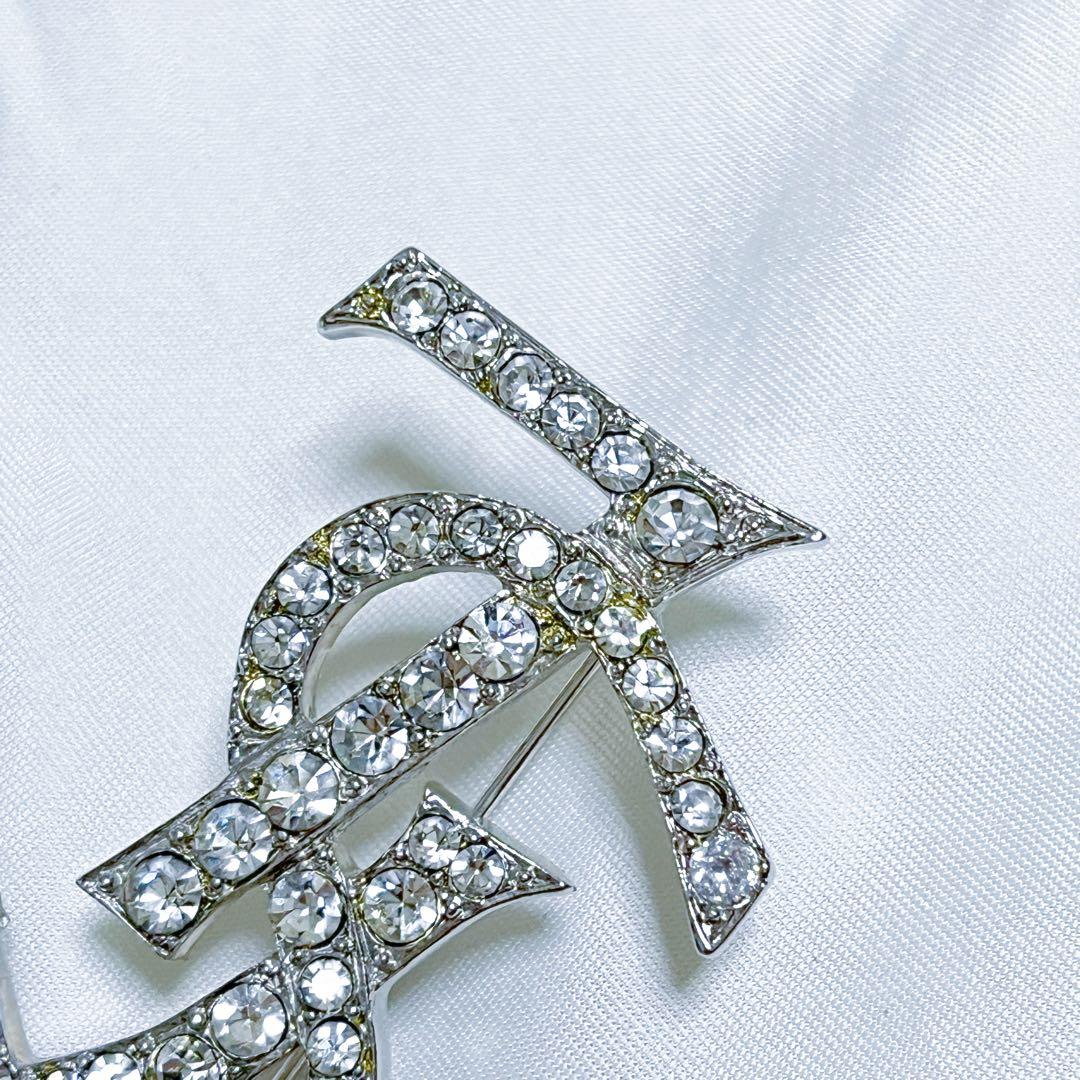 イヴサンローラン ブローチ カサンドラ YSLロゴ　ラインストーン シルバー