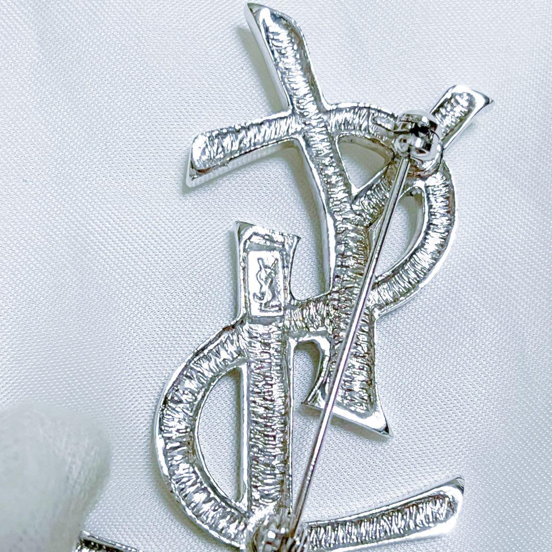 イヴサンローラン ブローチ カサンドラ YSLロゴ　ラインストーン シルバー