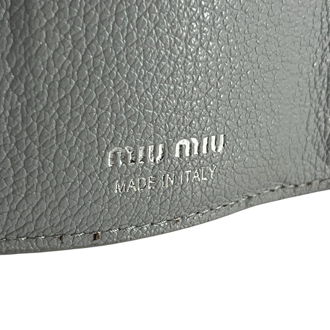 ミュウミュウ　折り財布　コンパクト財布　マドラス　パール　リボン　水色　レザー