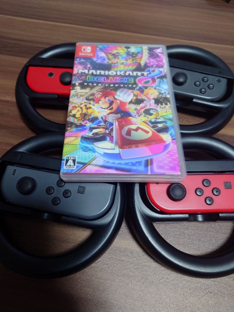 スイッチ本体 マリオカート8デラックス 赤のジョイコン・充電器・ハンドル付き