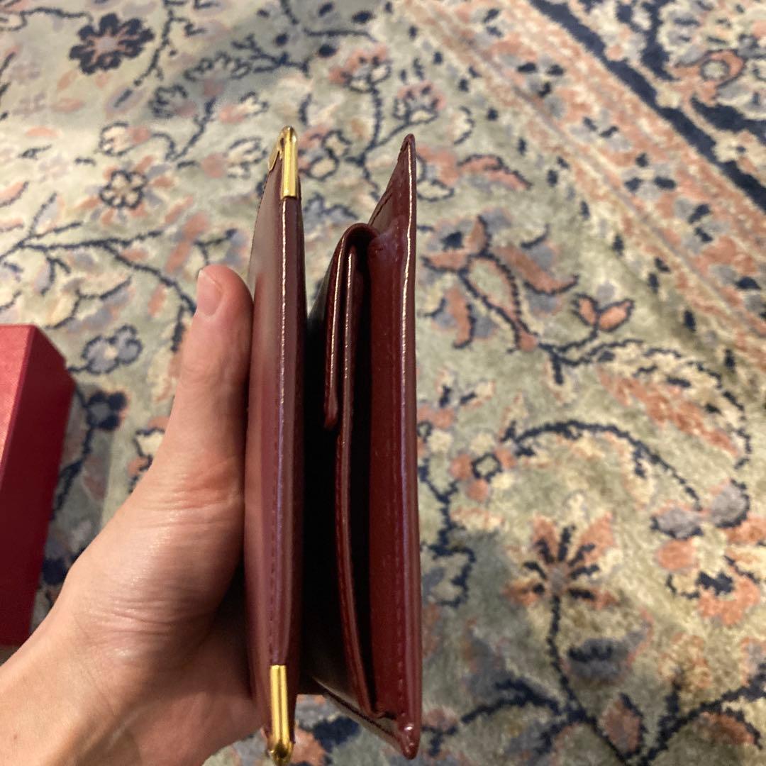 Cartier カルティエ　エンボスロゴ　二つ折り財布 ボルドー