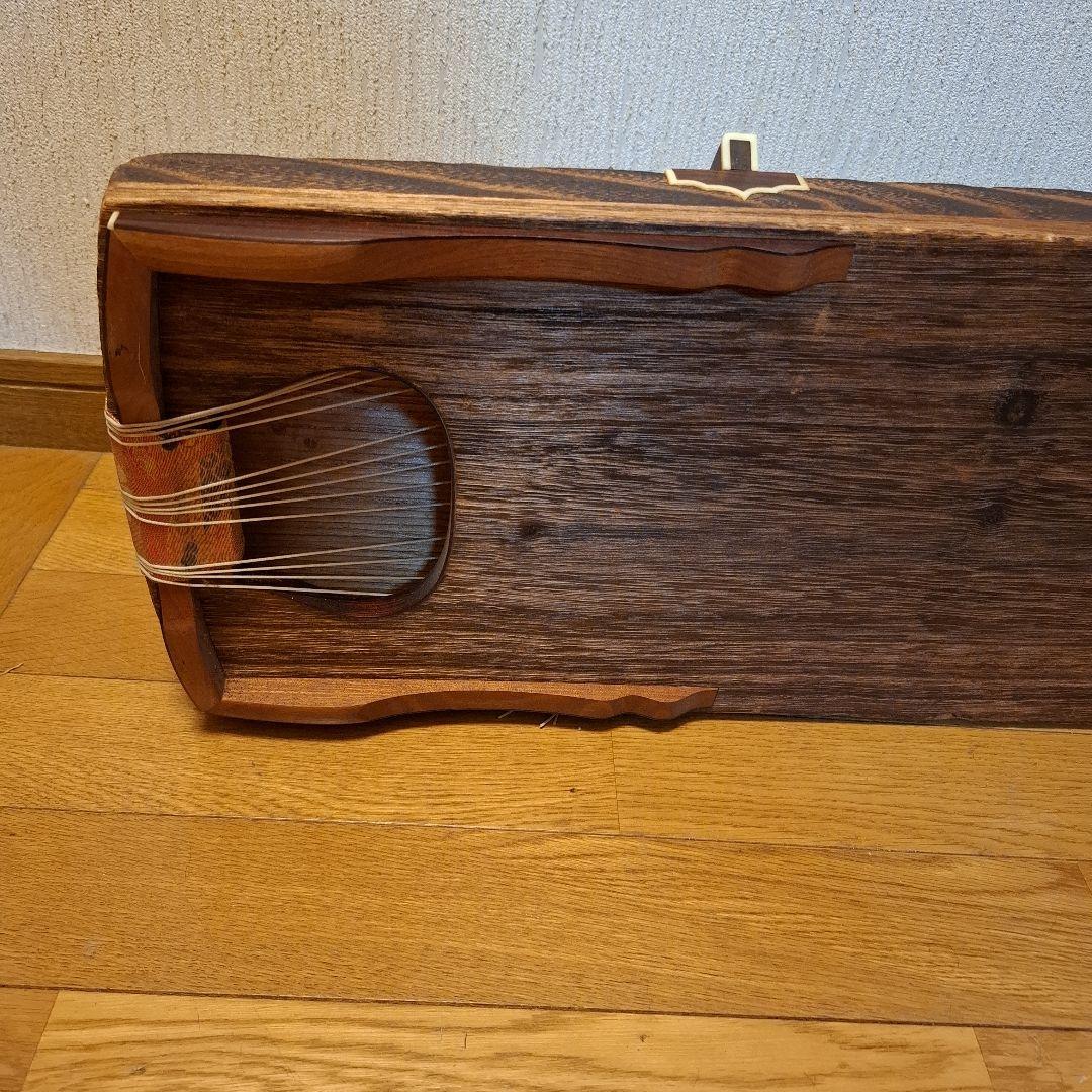 オレンジ色の鶴模様の袋つき　　　お琴