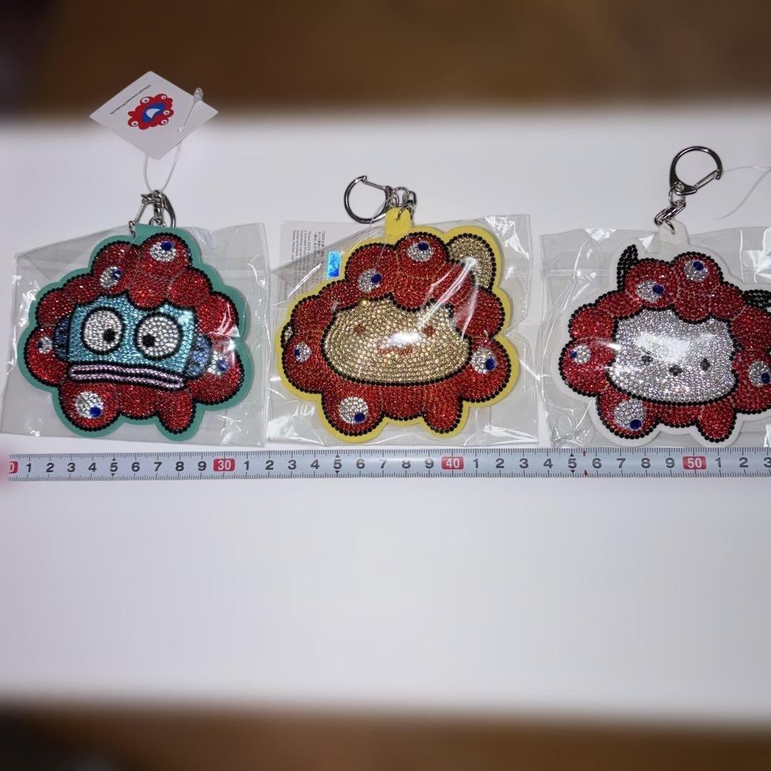 大阪関西万博　サンリオ　ミャクミャク　キラキラレザーキーホルダー