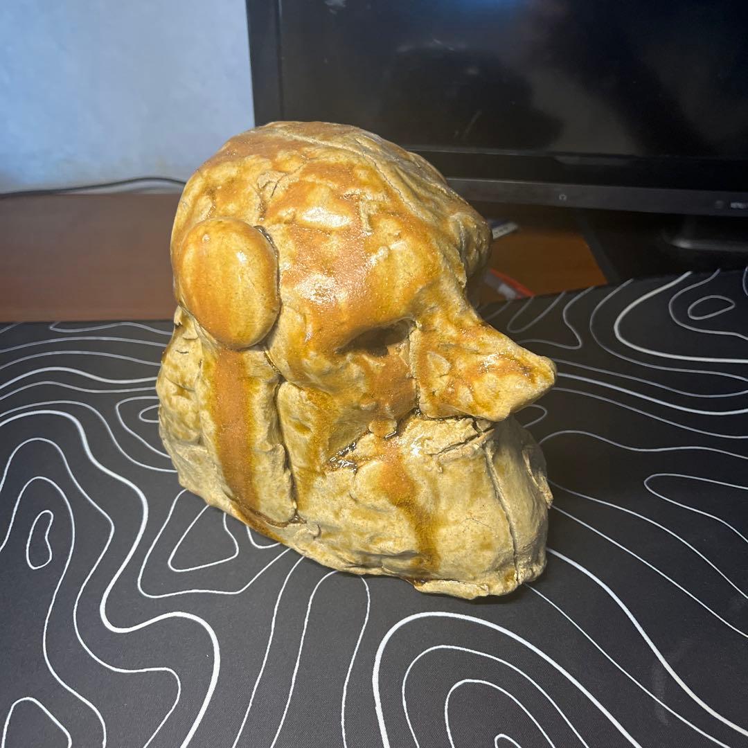 陶土製 人間と犬の顔の彫刻