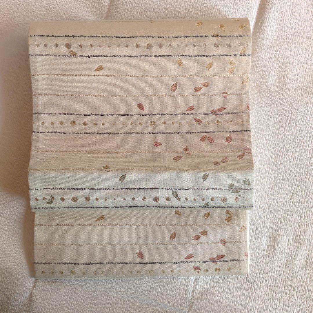 未使用　正絹袋帯　河瀬満織物　横段に花弁散らし　証紙アリ