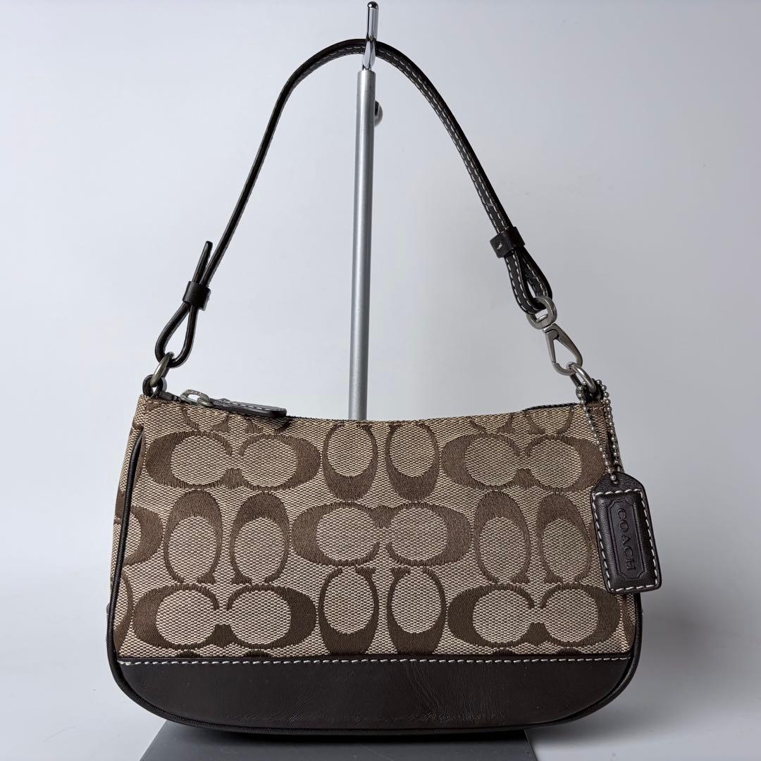 コーチ アクセサリーポーチaccessory pouch6094チャームブラウン