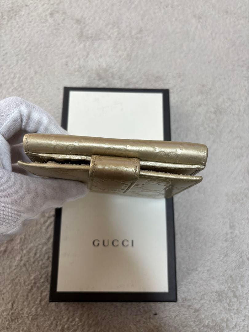8*様 GUCCI ゴールド　二つ折り財布　グッチ　GGマーク