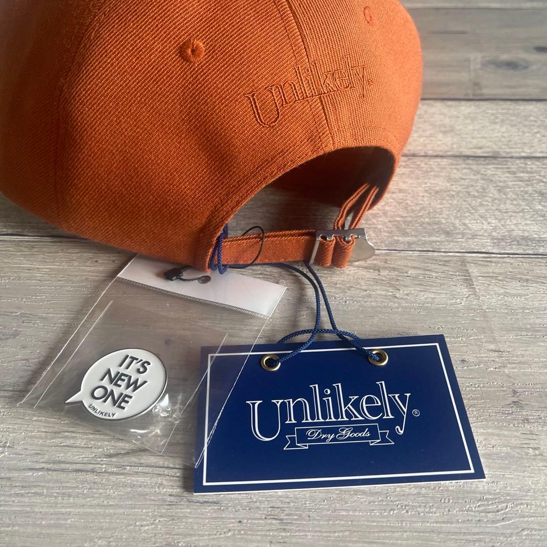 Unlikely Team Capアンライクリー26SSキャップ オレンジ帽子