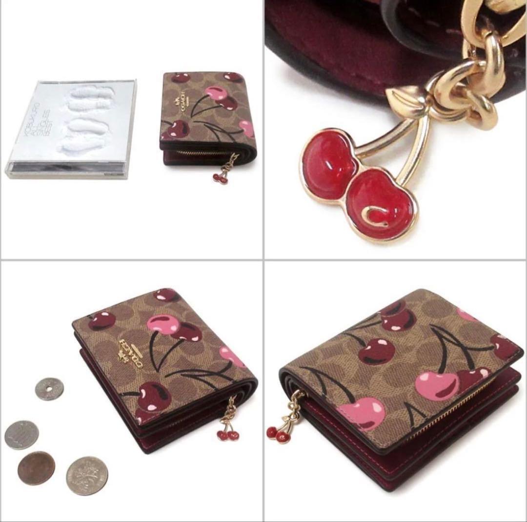 ぽ*ず様 初売り　COACH シグネチャーチェリープリント二つ折り財布、さくらん