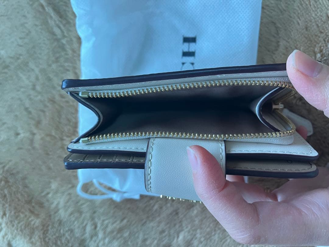 現状維持 COACH 二つ折り財布 ベージュ