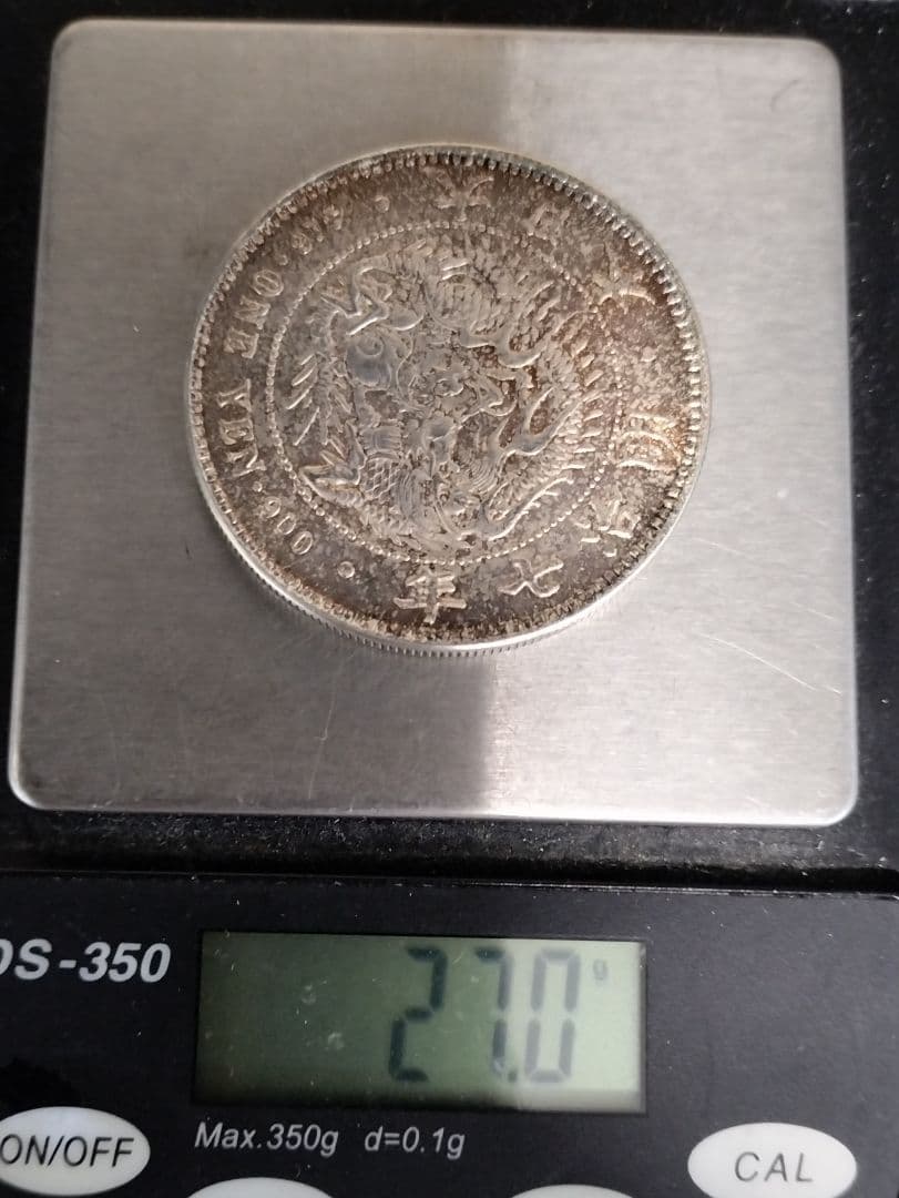 能*ー様 銀貨保証一円銀貨明治7年目方約27g銀含有率約90.6% 古銭1円銀貨