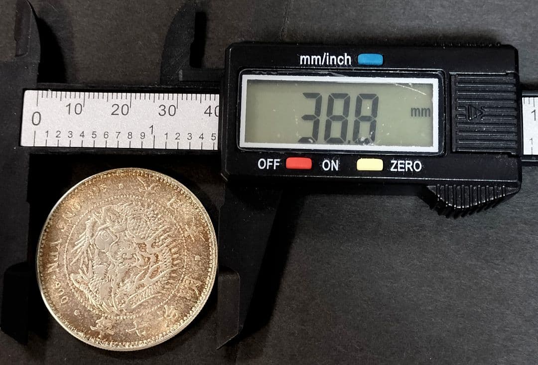 能*ー様 銀貨保証一円銀貨明治7年目方約27g銀含有率約90.6% 古銭1円銀貨