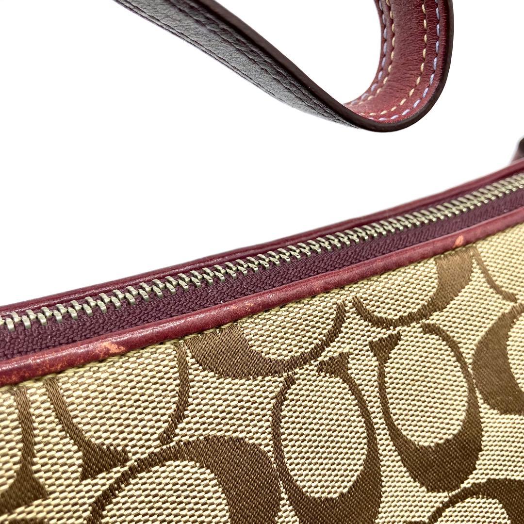 【美品】COACH コーチ ハンドバッグ アクセサリーポーチ シグネチャー　紫