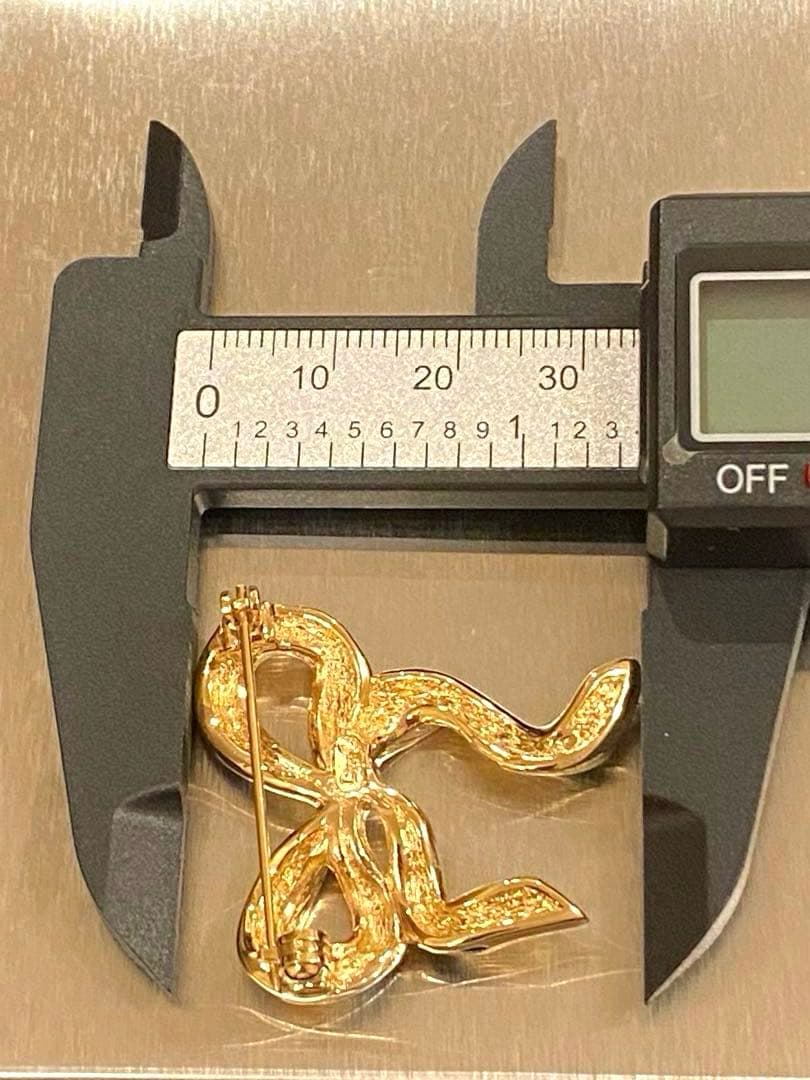 ✨正規品✨ Christian Dior ブローチ　ゴールド　ブラック　リボン型