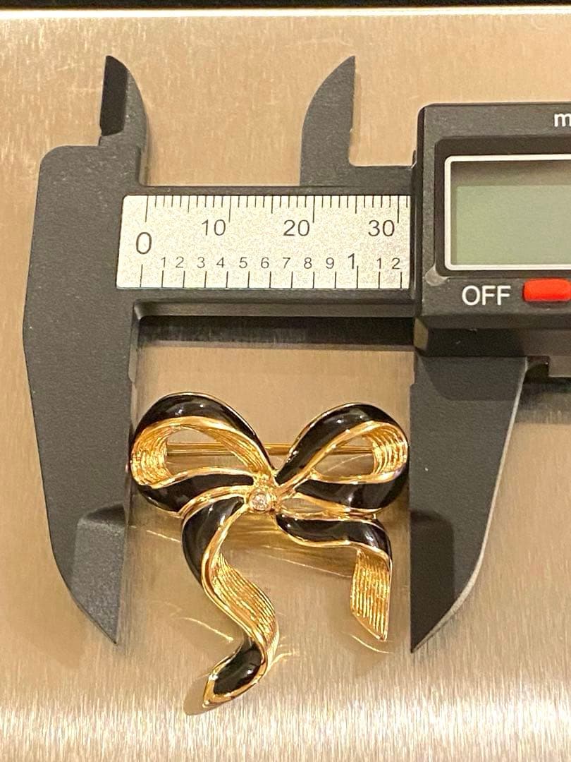 ✨正規品✨ Christian Dior ブローチ　ゴールド　ブラック　リボン型