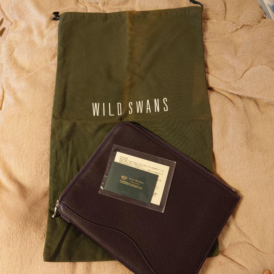 ワイルドスワンズ フォセット クラッチバッグ 王冠ロゴ パープル