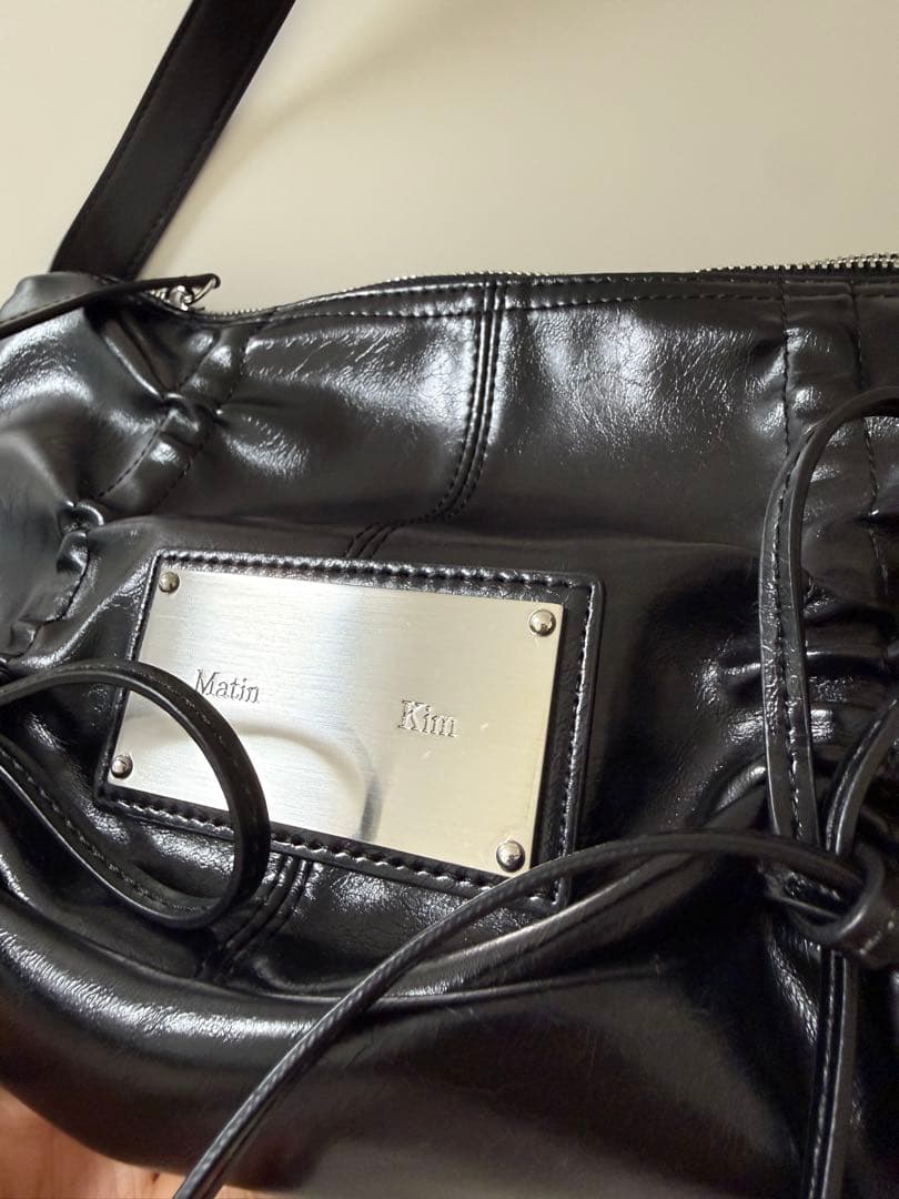 マーティン キム Matin Kim リボンラウンドバッグ ショルダーバッグ 黒
