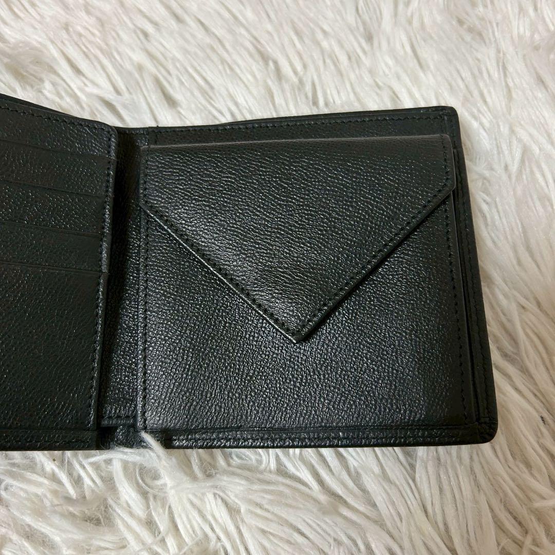 イヴサンローラン 二つ折り財布　ロゴ型押し ブラック