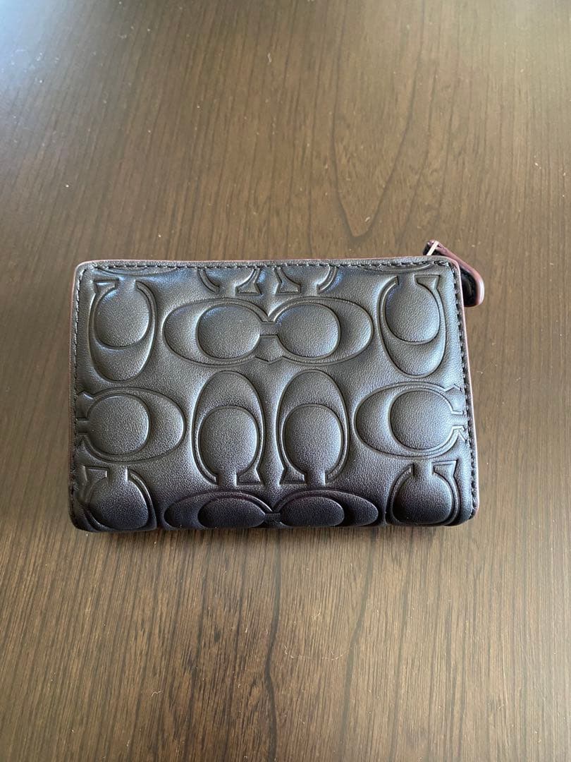 COACH エンボス加工 ブラック 二つ折り財布