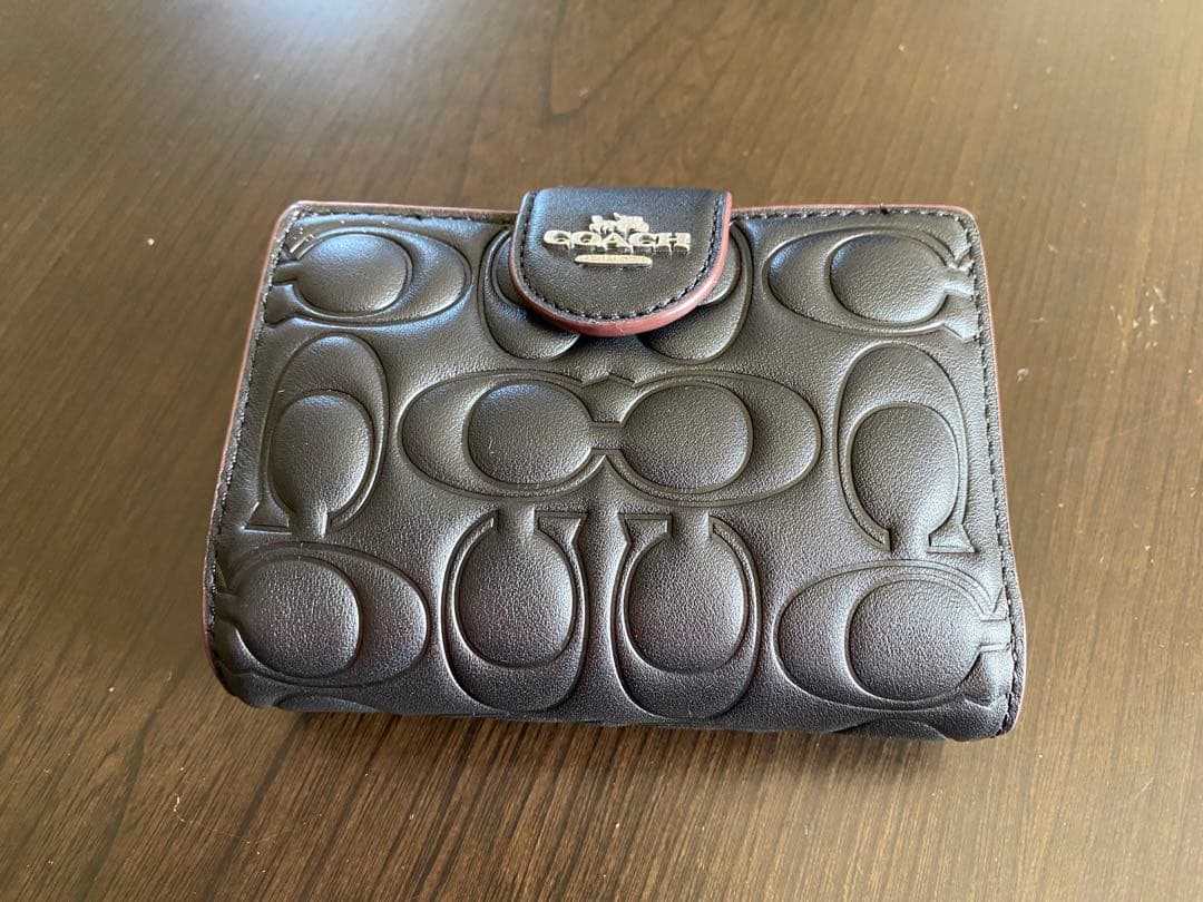 COACH エンボス加工 ブラック 二つ折り財布