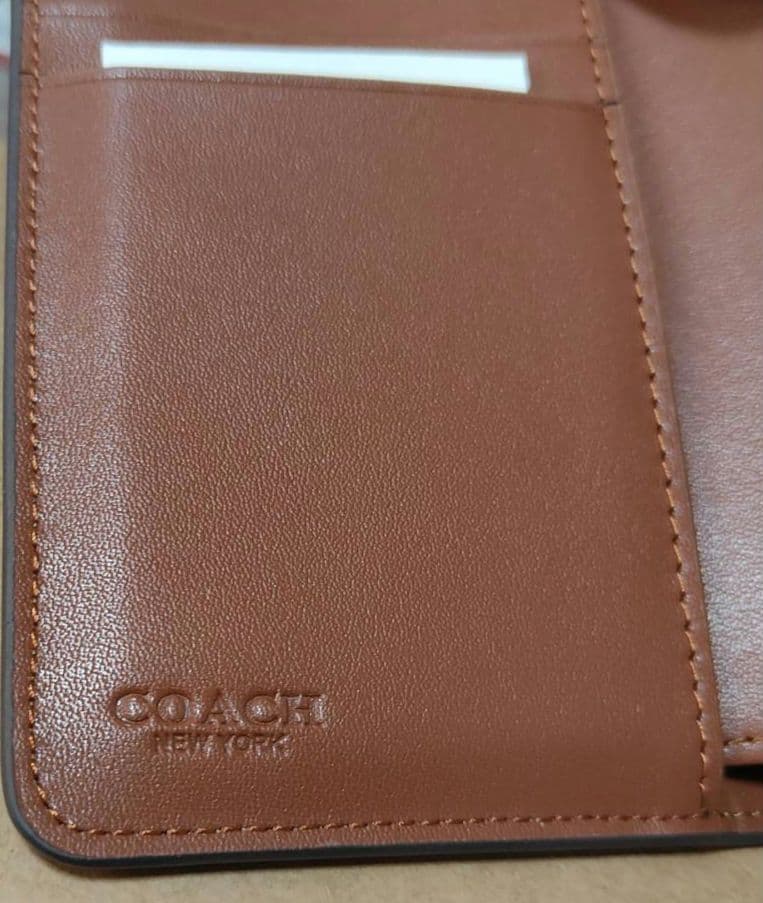 新品未使用 COACH 二つ折り財布 アウトレット品 シグネチャー 定番
