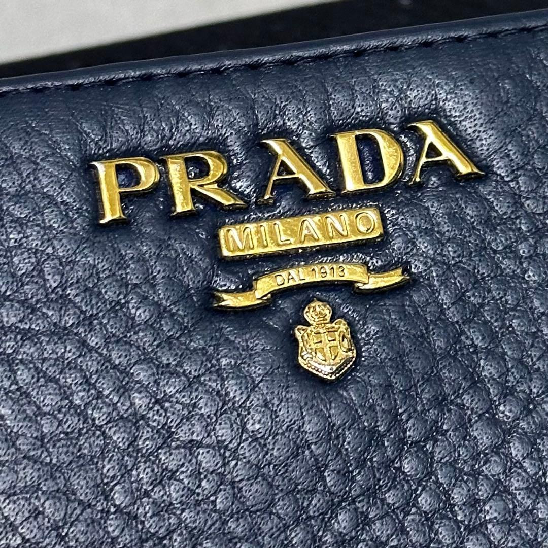 PRADA プラダ　折り財布　ラウンドファスナー　ブルー　ゴールドロゴ シボ革