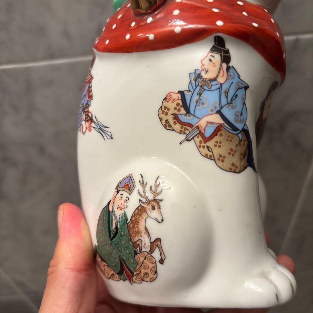 ヴィンテージ縁起の良い七福神が描かれ、可愛らしい瞳の招き猫