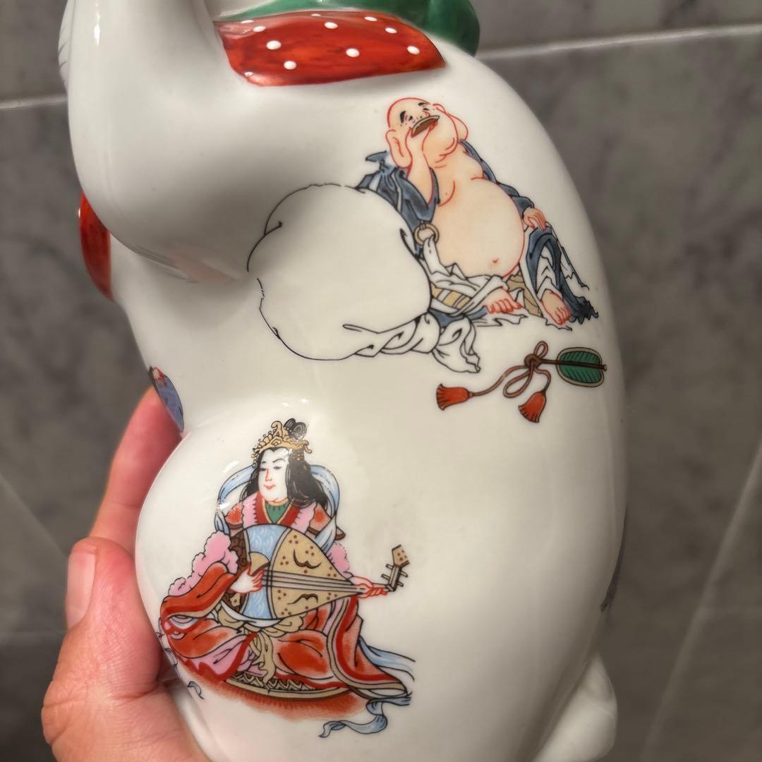 ヴィンテージ縁起の良い七福神が描かれ、可愛らしい瞳の招き猫