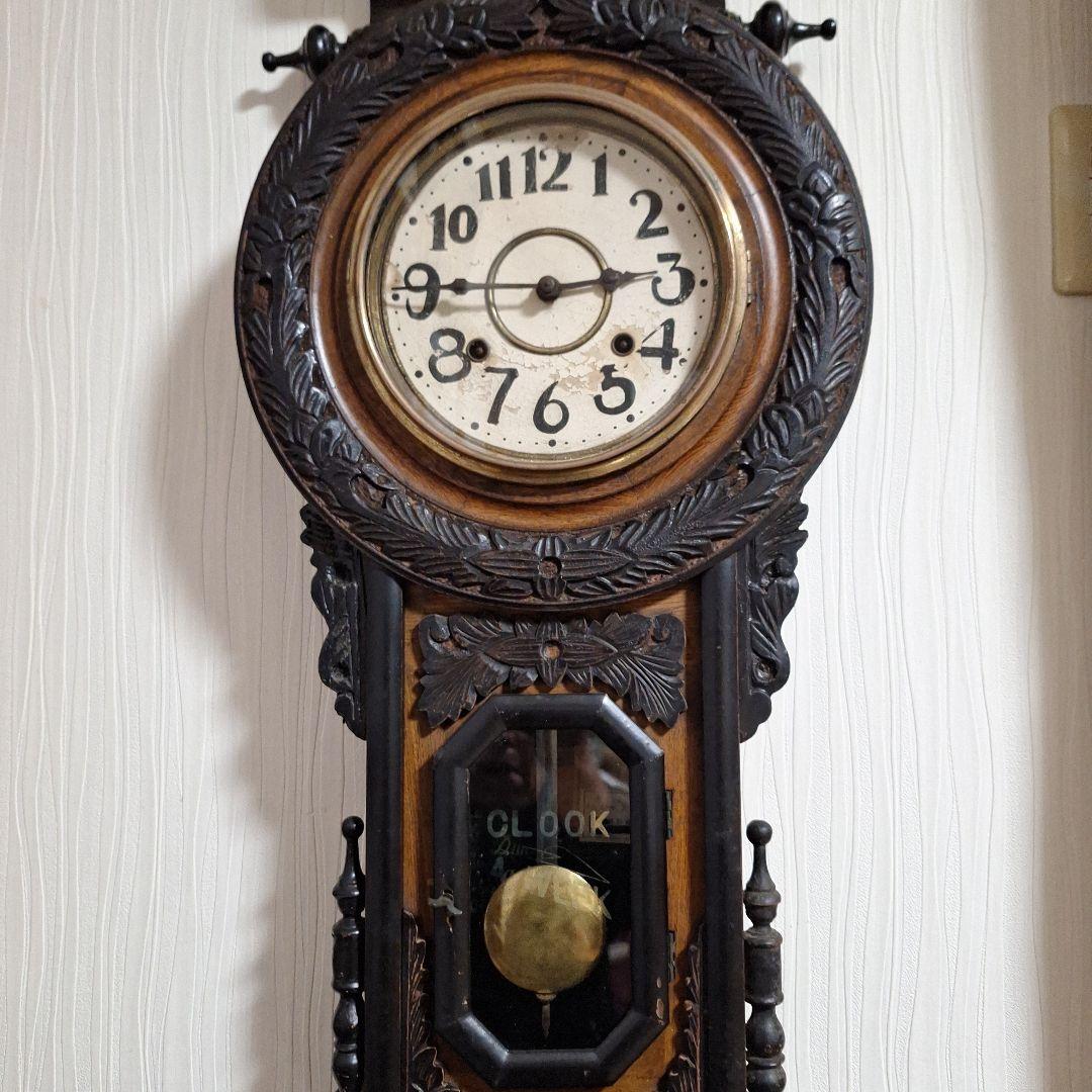 324 彫刻入り振り子掛時計　小型ひまわり柱時計