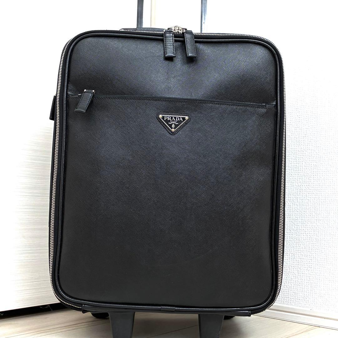 正規品 プラダ キャリーケース 三角ロゴ 白タグ サフィアーノレザー メンズ 黒