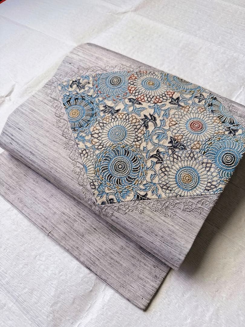 【未使用　お仕立て上り】　正絹　名古屋帯　紬地　型染めに相良刺繍　華唐草