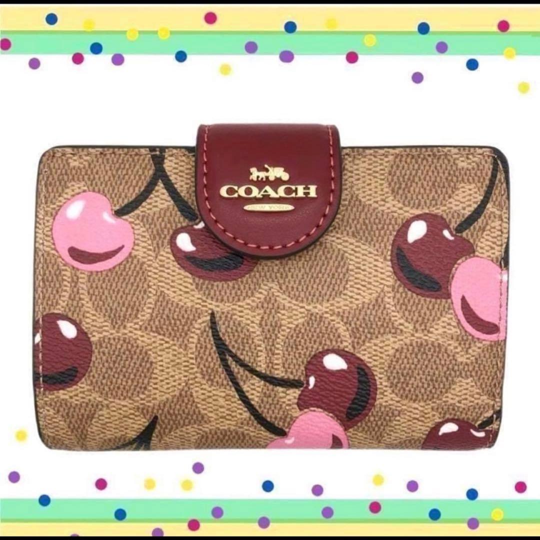 人気のcoachコーチシグネチャーチェリープリントミディアム二つ折り財布