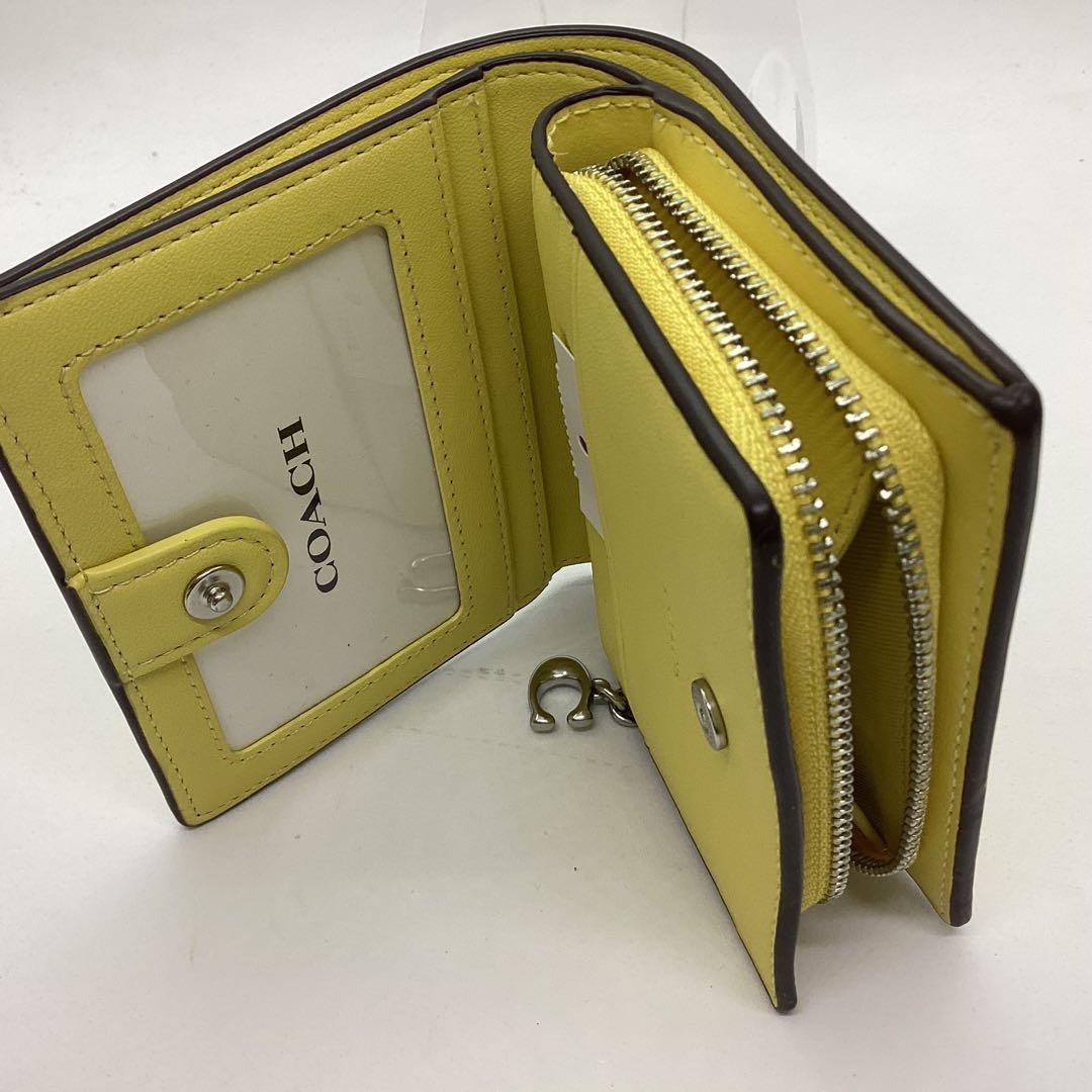 COACH 花柄 二つ折り　コンパクト　財布 イエロー