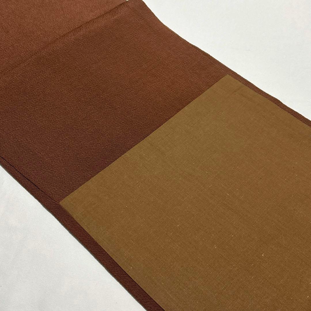 開き名古屋帯【栗山吉三郎】和染紅型 縮緬 垣根文様 茶色 お太鼓柄 正絹 九寸帯