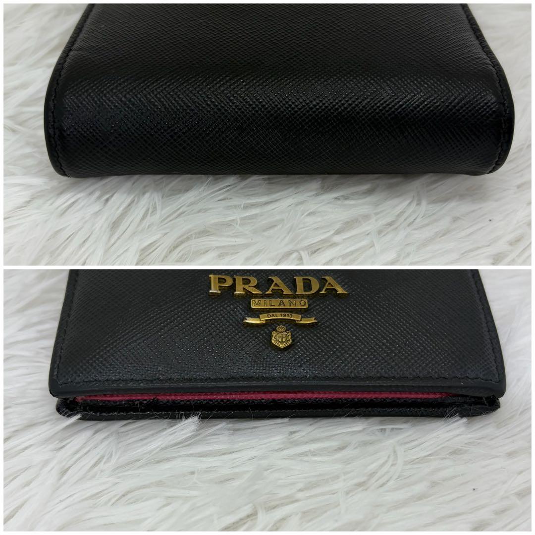 美品✨️プラダ 二つ折り財布 レザー バイカラー　サフィアーノ 黒 ピンク