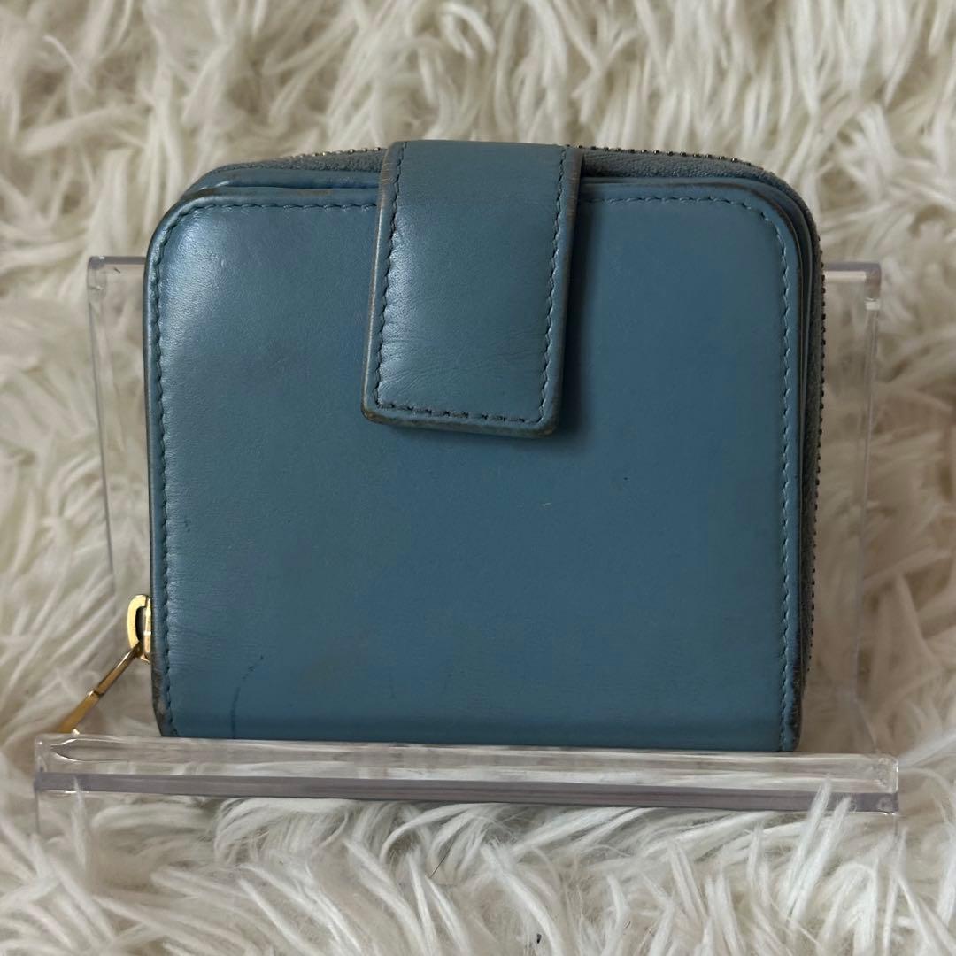 イヴサンローラン 二つ折り財布 型押し レザー ジップ ライトブルー コンパクト