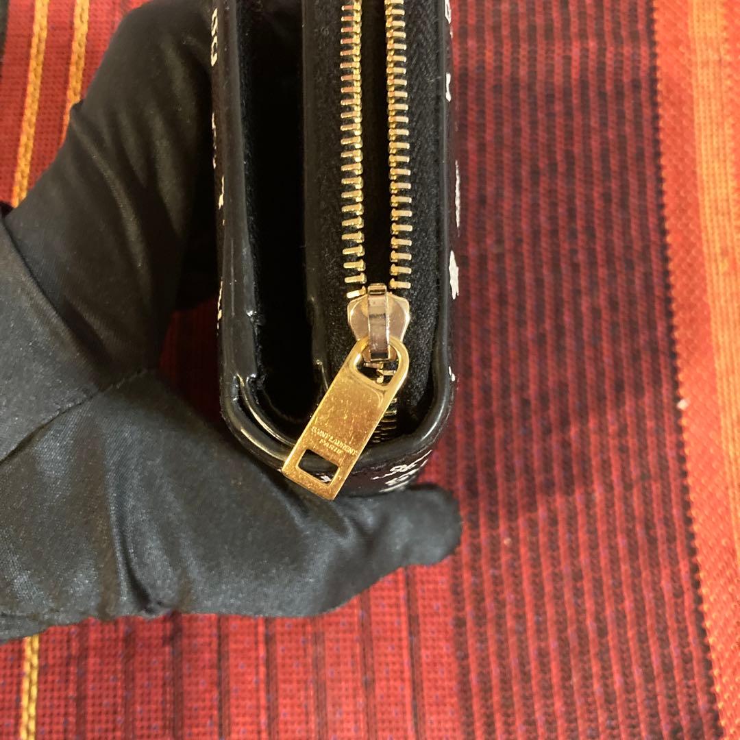 サンローラン 折り財布 ラウンドファスナー カサンドラ ロゴ 総柄